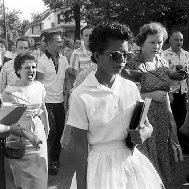 photo of white woman yelling at black woman. 