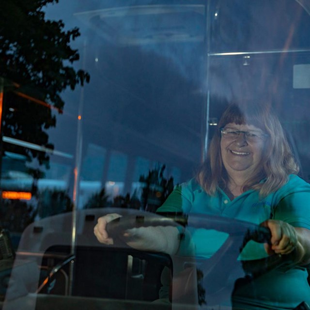 Sue behind the wheel of the Island Explorer bus at Acadia