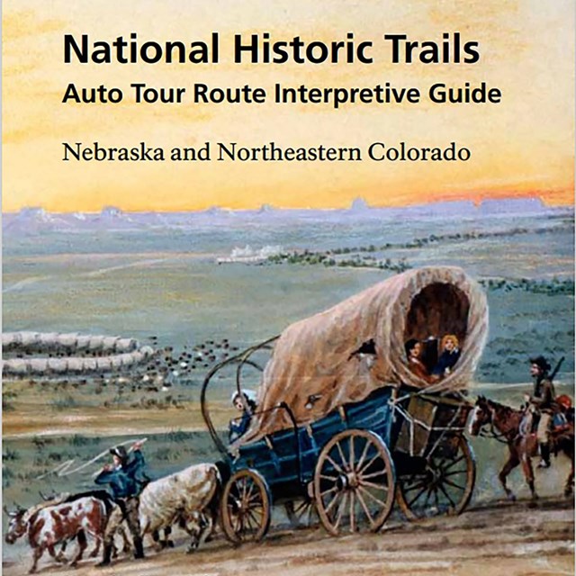 The cover of a travel guide that has an illustration of a covered wagon train in the plains.