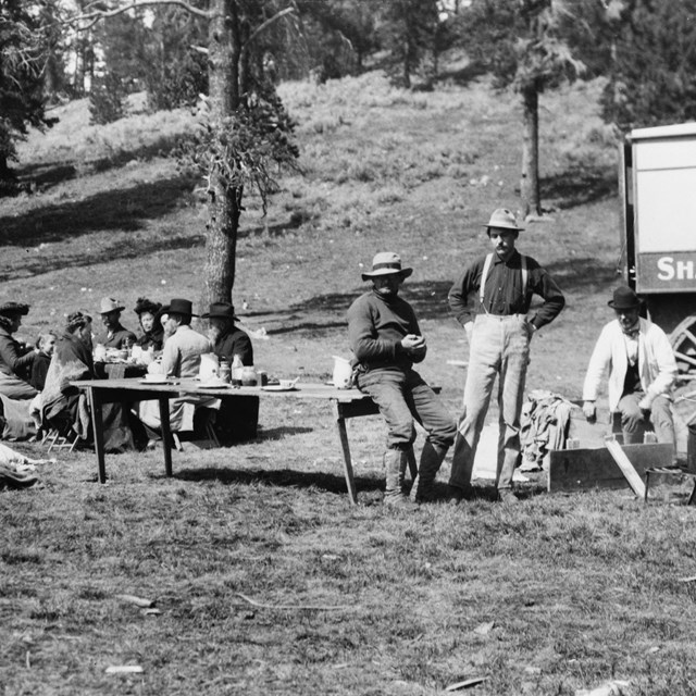 Tourists and guides picnicking in Yellowstone Park