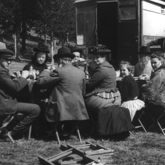Frances Benjamin Johnston at picnic table in Yellowstone National Park