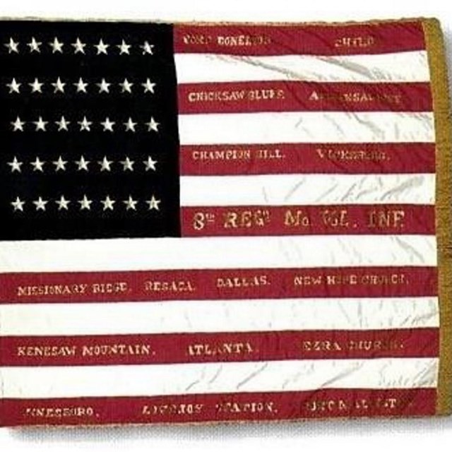 American Flag with gold text on every red stripe