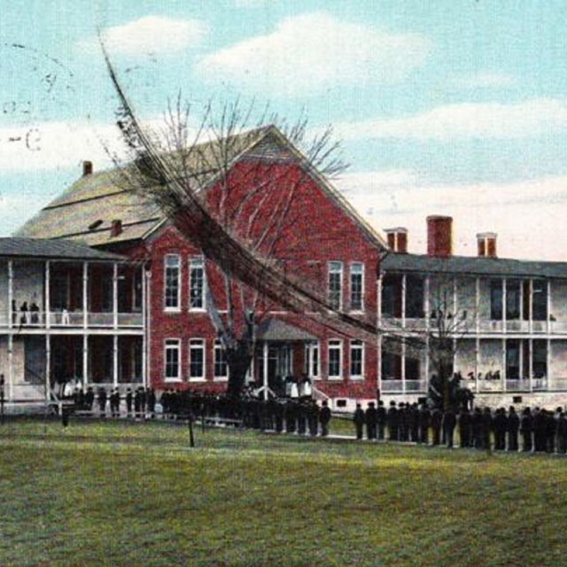 Image of a large red house. 