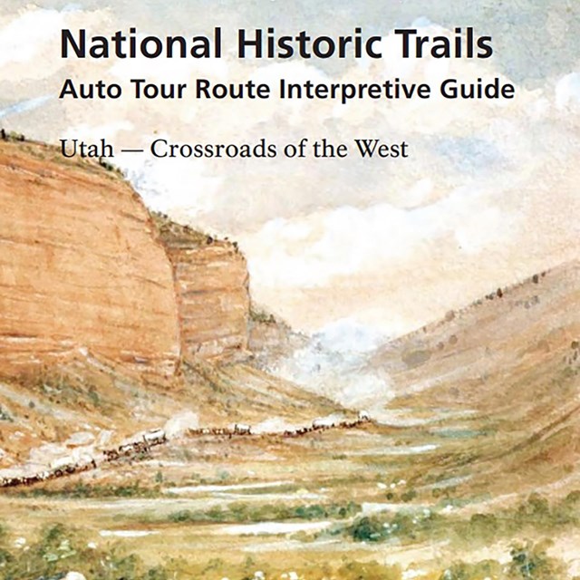 The cover of a travel guide that has an illustration of a large, wide canyon with a wagon train