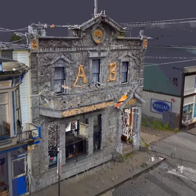 Photographic rendering of wooden building with antler decorations and balcony