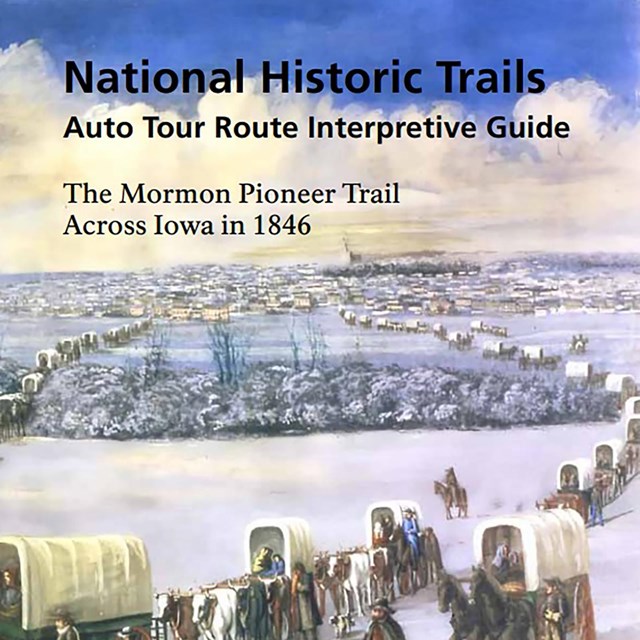 The cover of a travel guide that has an illustration of a covered wagon train crossing a snowy area.