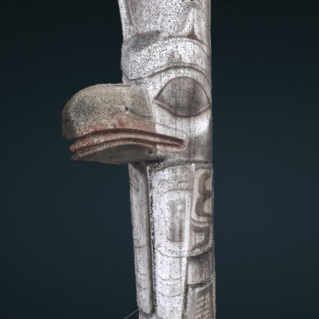 3d render of wooden totem pole with frog and raven carvings