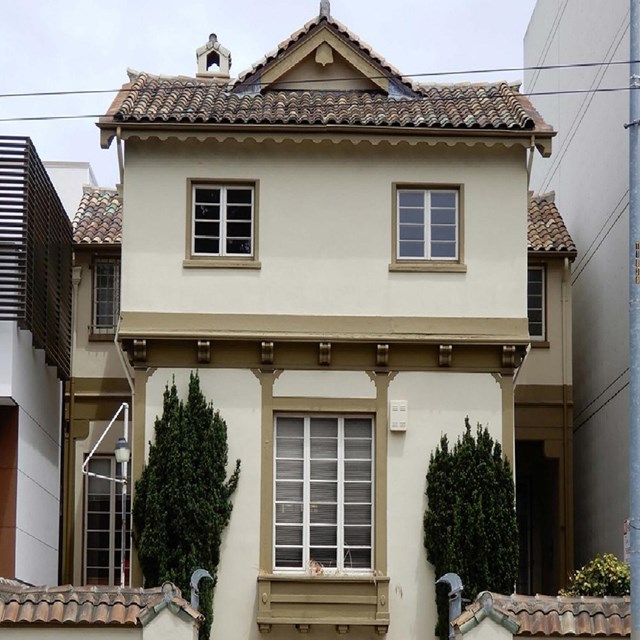 Exterior of beige building with tiled roof