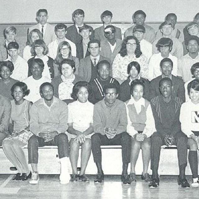 Photo of white and Black high school students. 