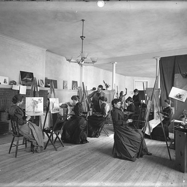 Women painting at easels