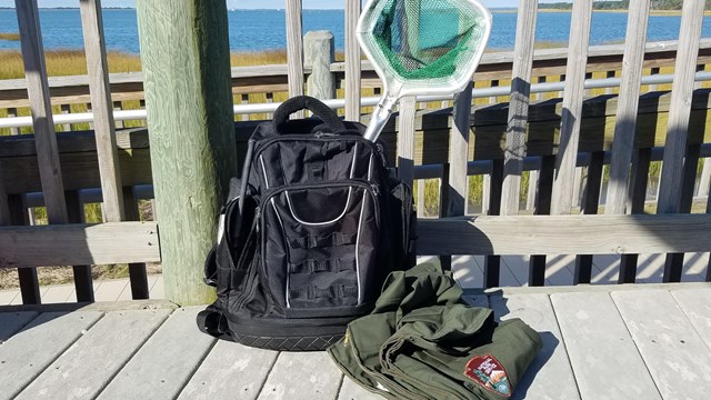 A backpack with a net and jacket