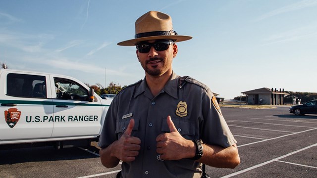 photo of law enforcement officer giving the thumbs up sign. photo by Krystina Carpenter