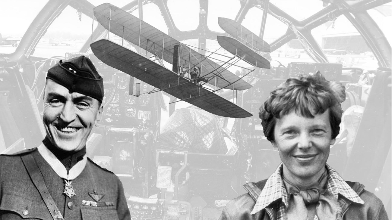 A man and a woman pose in front of a plane cockpit with an early airplane in the background