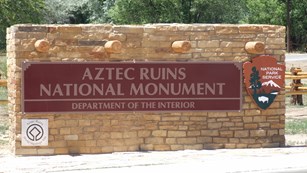 The entrance sign at Aztec Ruins National Monument.