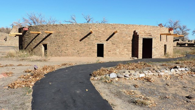 A reconstructed Great Kiva and the paved path leading to it.