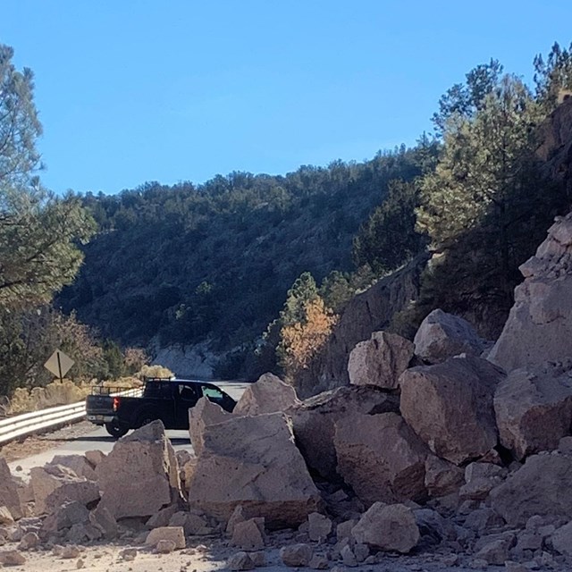 A rockslide blocks the highway.