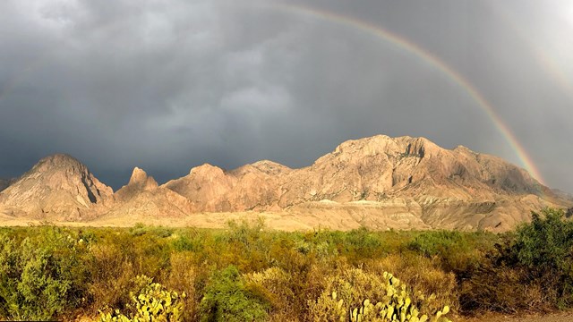 A rainbow frames the mountains of Big Bend.