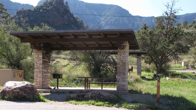 Campsite with shade structure in the Chisos Basin.