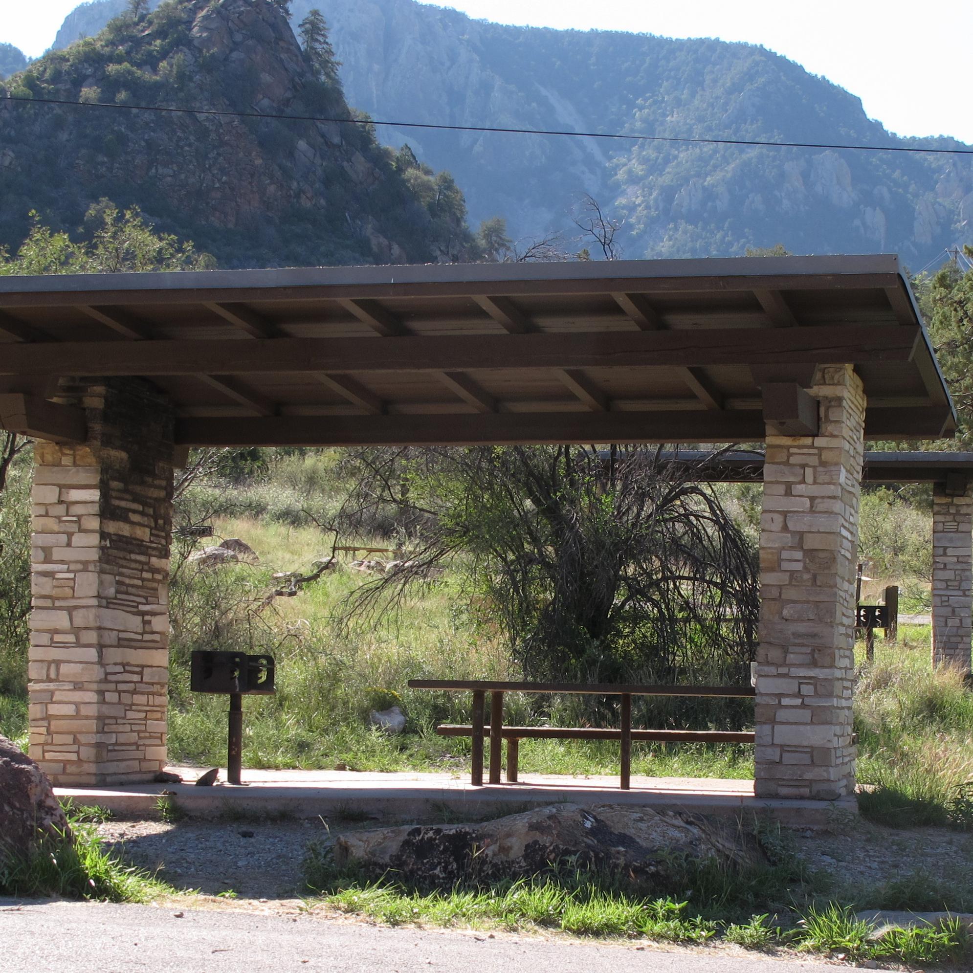 Campsite with shade structure in the Chisos Basin.