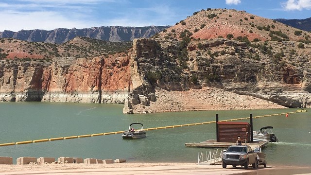 Barry's landing with a boat being launched and another waiting in the water.