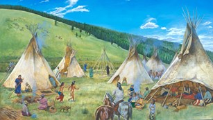Several tepee poles in a meadow on a sunny day.