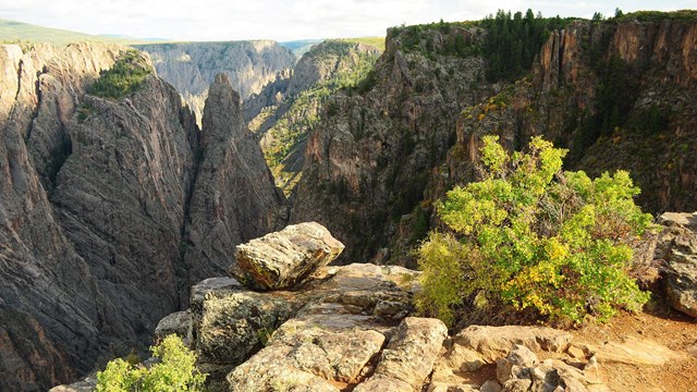 A view into a canyon from a rocky outcropping