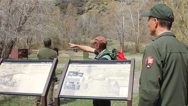 People stand around a relief map of Black Canyon of the Gunnison