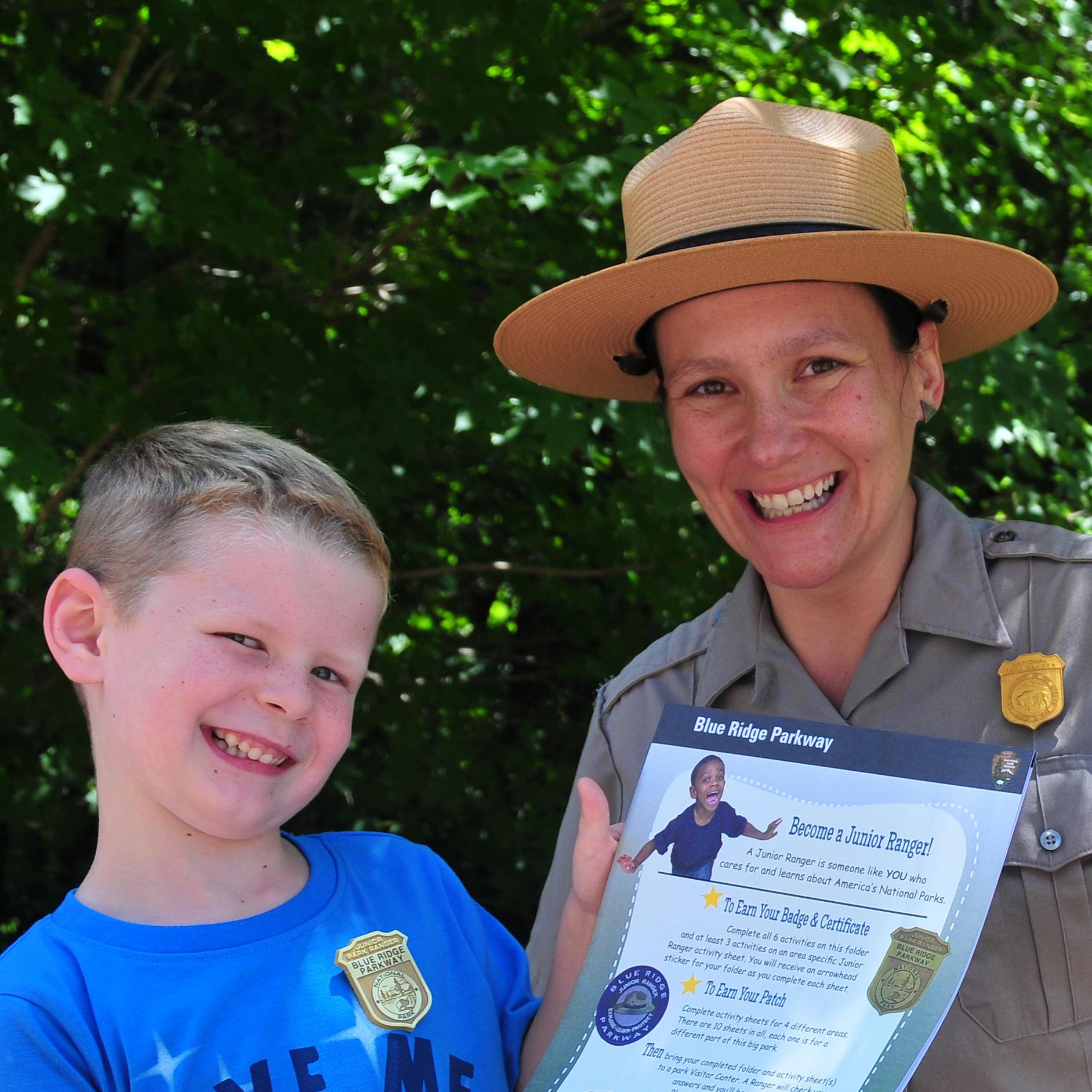 A female park ranger gives the 
