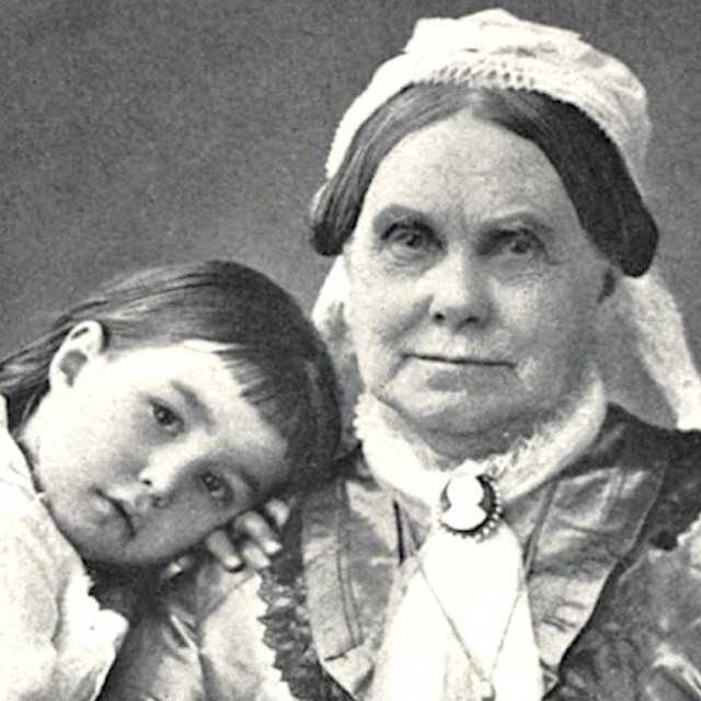 Elizabeth Chace seated with daughter Lillie leaning against her arm