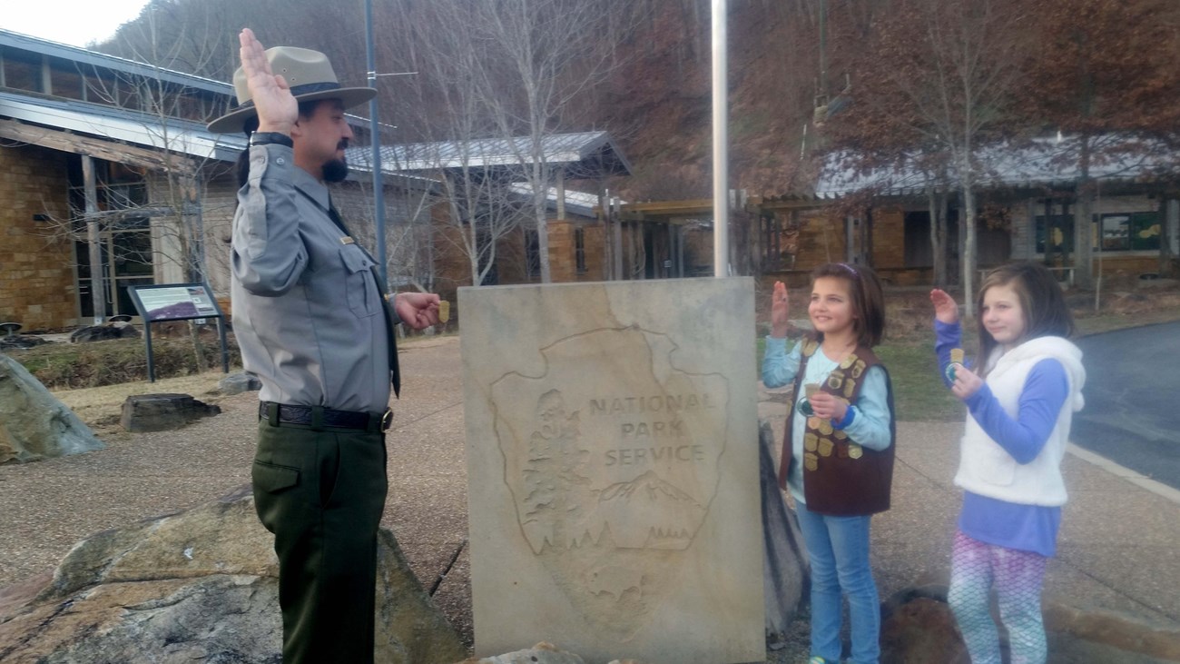 two girls getting sworn in as Junior Rangers