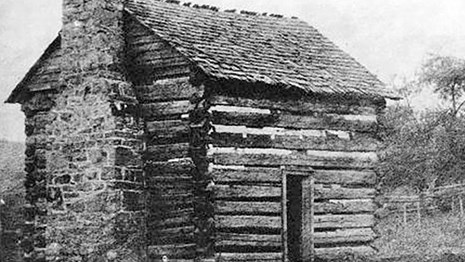 historic image of an old cabin
