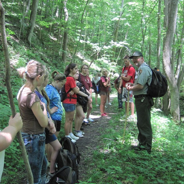 ranger with students on the trail