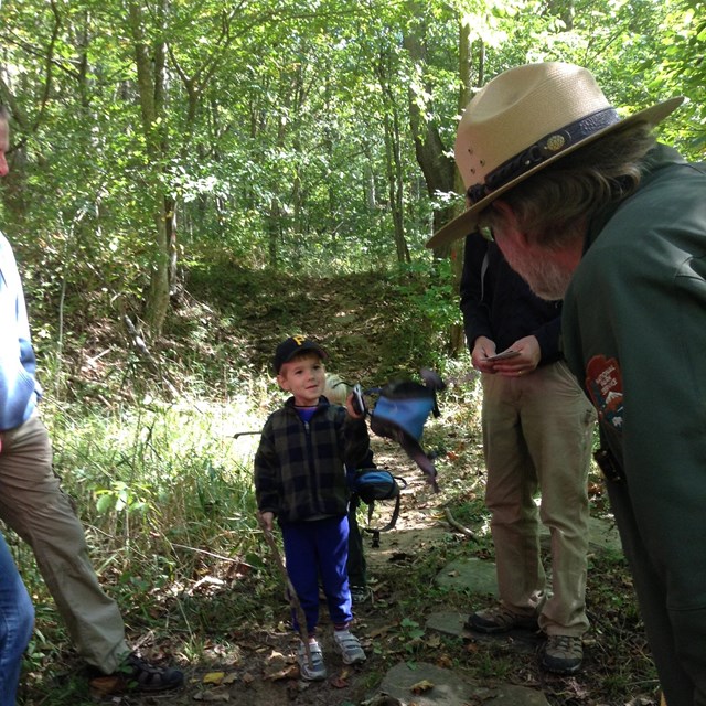 ranger talking to a boy