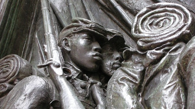 Close-up of the 54th Massachusetts Regiment Memorial, focusing on the soldiers.