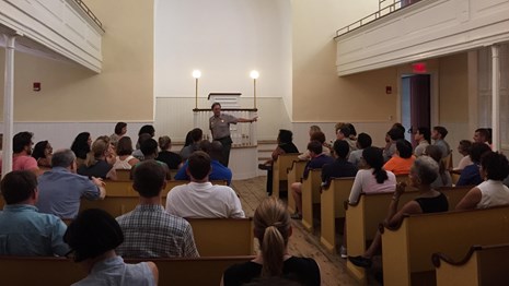 Ranger leading a talk at the African Meeting House