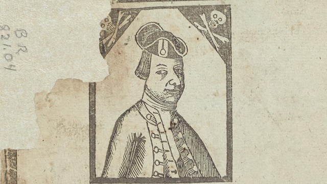 stamped engraving of a portrait of a sea captain with skulls and crossbones in each upper corner