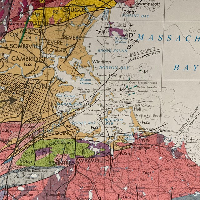 A multicolored map of Boston and the surrounding area filled with different colored layers represent
