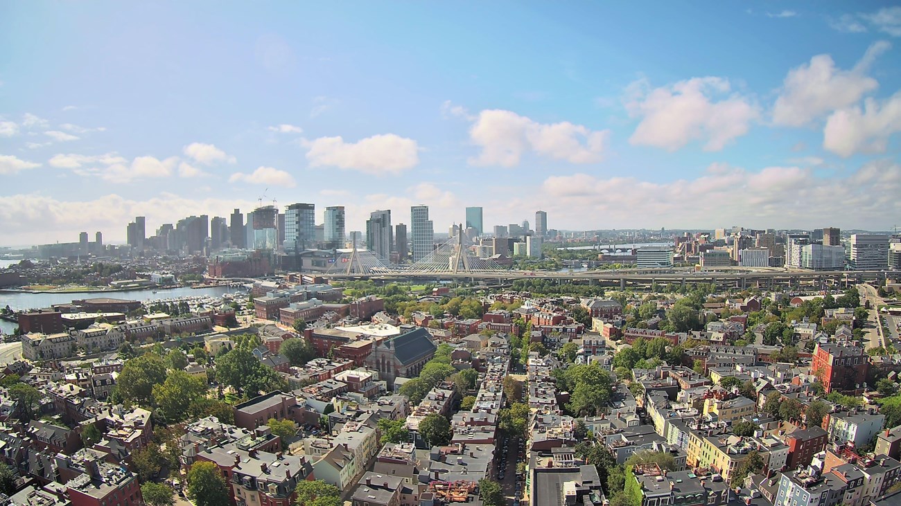 Aerial view of the City of Boston and Zakim Bridge from the top of the Bunker Hill Monument. 