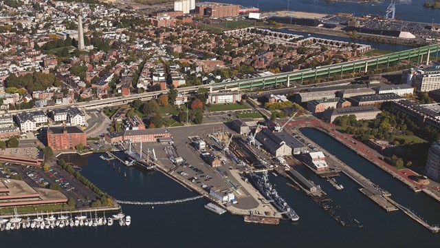 Aerial view of the Charlestown Navy Yard with USS Constitution and USS Cassin Young in view.