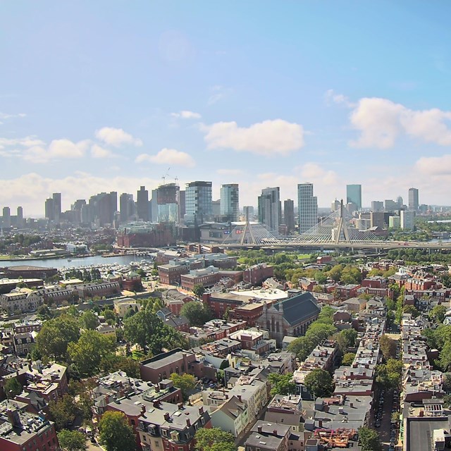 Aerial view of the City of Boston and Zakim Bridge from the top of the Bunker Hill Monument. 