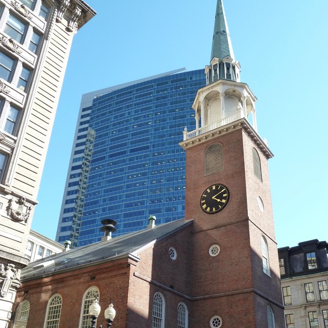 The brick Old South Meeting House with its clock tower capped with a steeple