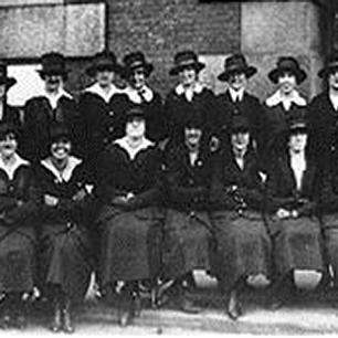 Black and White photograph of women in navy uniform for a unit photo