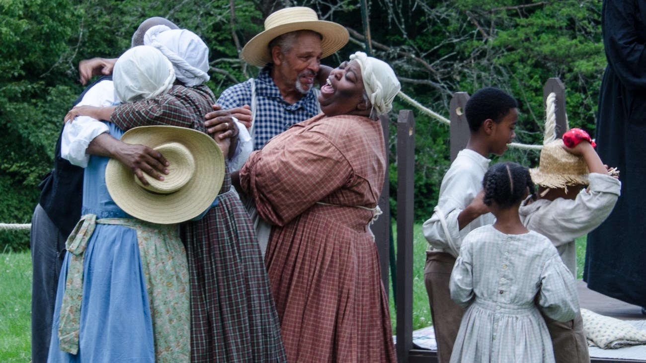 Re-enactors portraying enslaved residents once freed