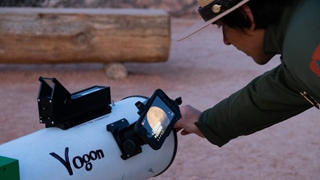 Ranger interacts with visitors through iPhone mounted to telescope