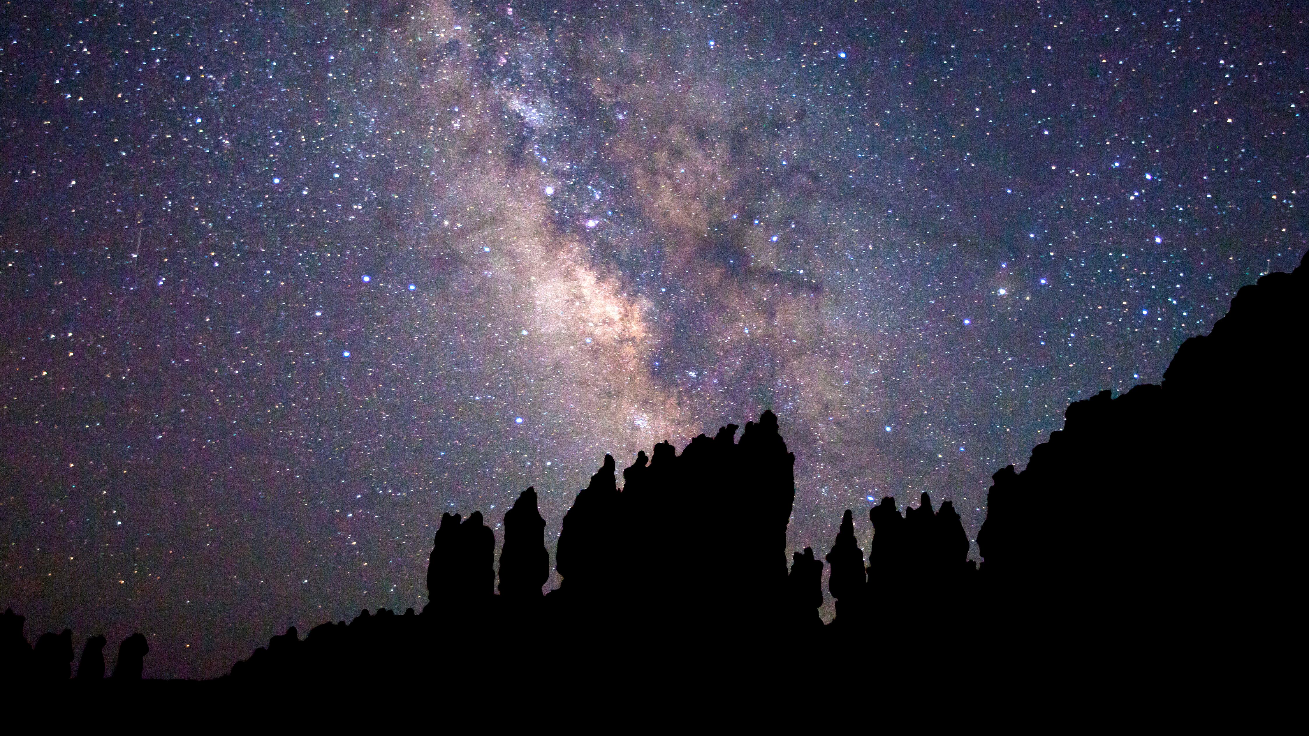 A dark night sky is the backdrop to the bright stars of the milky way.