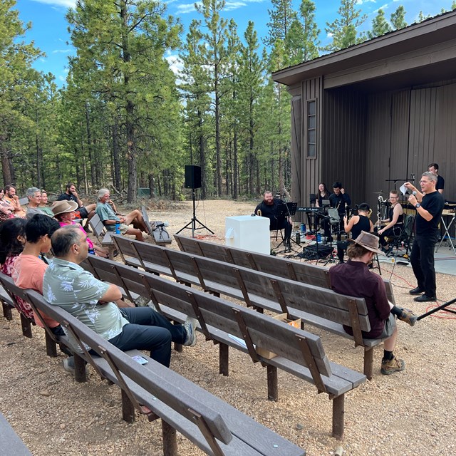 A band performs at an outdoor theater.