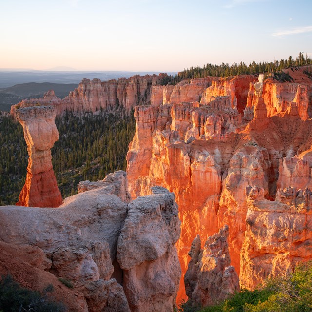 Red rock formations glowing orange in the sun.