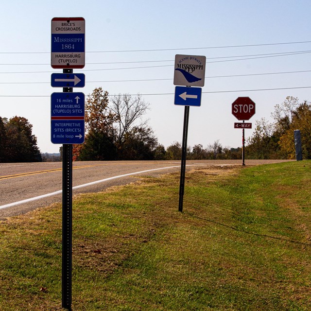 Road signs directing travelers at Brices Cross Roads National Battlefield Site