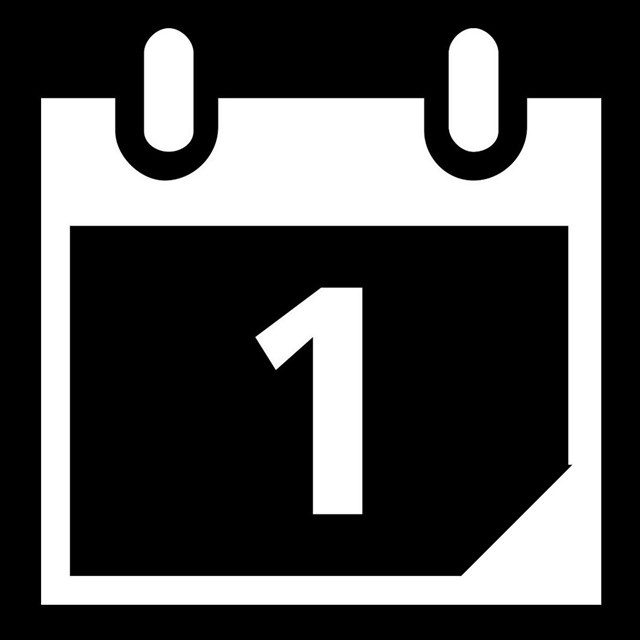 A black and white pictograph of a calendar.