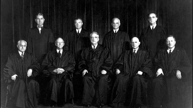 Nine justices sit in their judicial robes